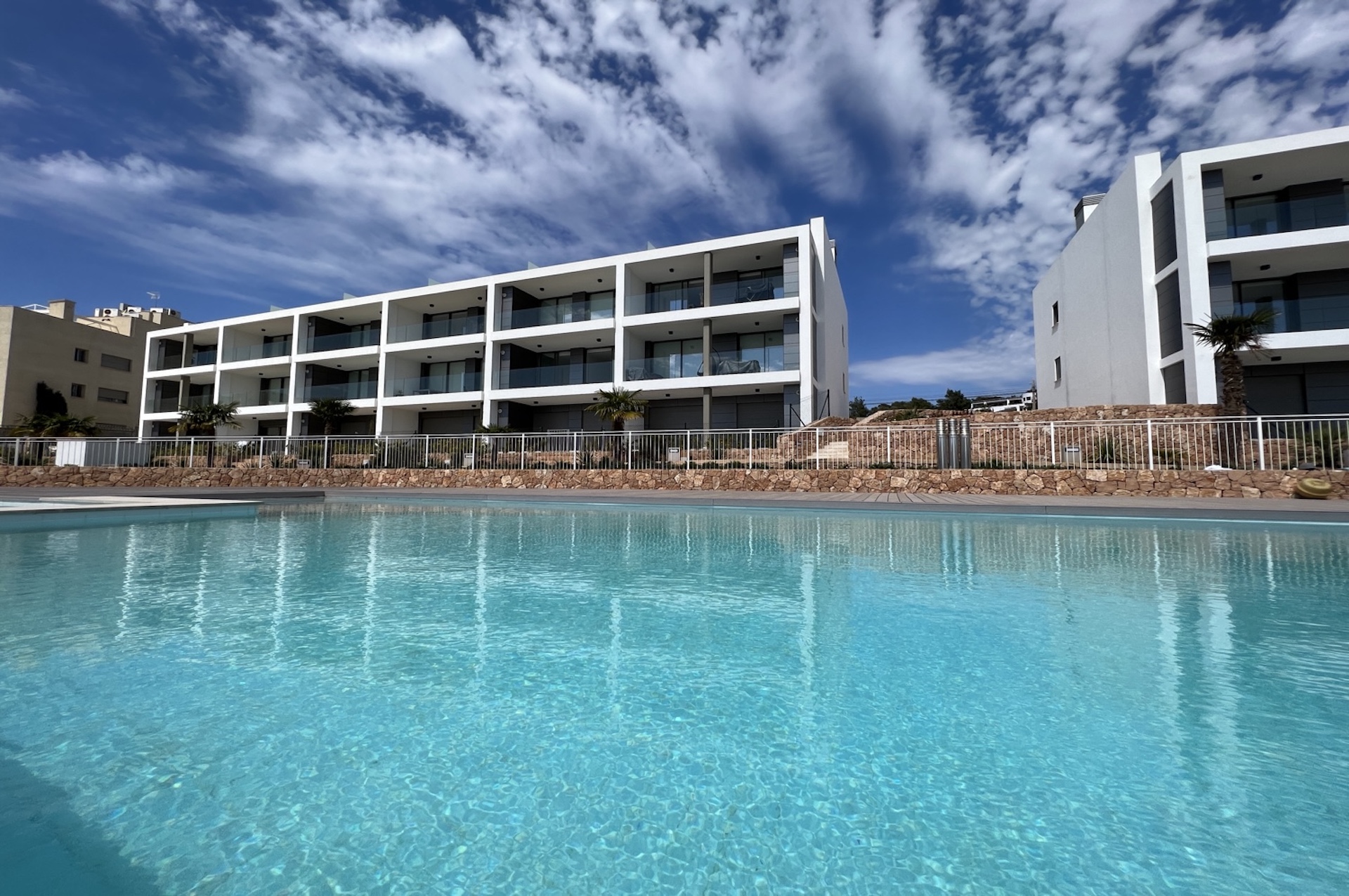 Resa Estates Ibiza apartment for sale te koop zeezicht sea views Cala gracio pool building.jpeg